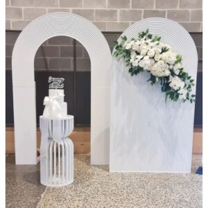 white ripple backdrop and arch with curved hourglass plinth for hire in Melbourne